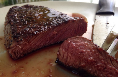 Pan seared sirloin with sweet potato hash and salsa verde sauce